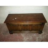 AN OAK LINENFOLD PANELLED BLANKET CHEST