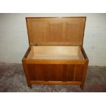 AN OAK PANELLED BLANKET CHEST, 1970S ON CASTORS