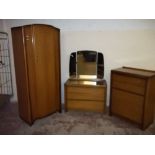 A 1960S THREE PIECE BEDROOM SUITE TO INCLUDE WARDROBE, FIVE DRAWER CHEST AND A DRESSING TABLE