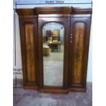 A LARGE MAHOGANY TRIPLE DOOR VICTORIAN BREAKFRONT WARDROBE