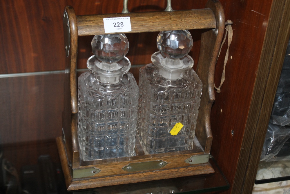 A TWO BOTTLED TANTALUS, NO MAKER'S MARK