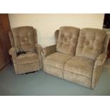 A TWO PIECE SUITE TWO SEATER SOFA AND A RISER RECLINE CHAIR