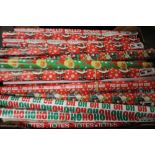 A QUANTITY OF OFFENSIVE CHRISTMAS GIFT WRAP (NOT INCLUDING TRAY)