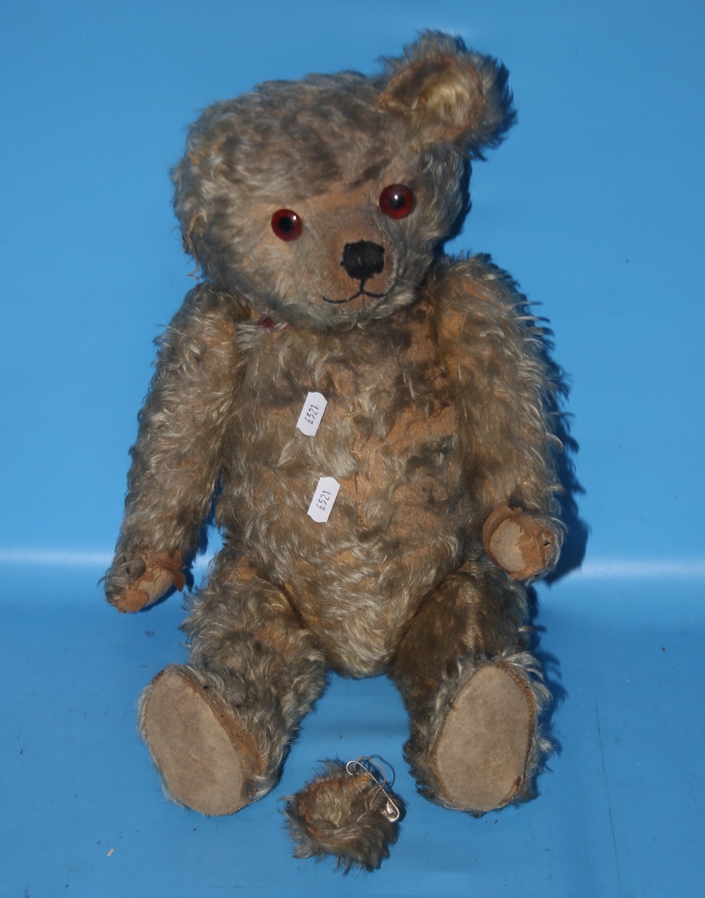 A VINTAGE PLAYWORN TEDDY BEAR