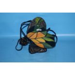 A TIFFANY STYLE LAMP IN THE FORM OF A BUTTERFLY