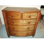 A BOW FRONTED 1930S CHEST OF DRAWERS