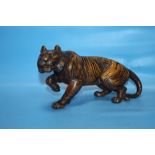 A METAL FIGURE OF A TIGER