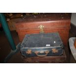 AN ANTIQUE TRUNK AND TWO VINTAGE SUITCASES