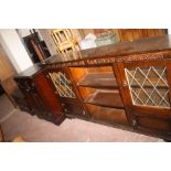 A DARK OAK DISPLAY UNIT, ENTERTAINMENT UNIT AND WIDE BOOKCASE/SIDEBOARD