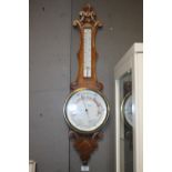 AN OAK ANEROID BAROMETER