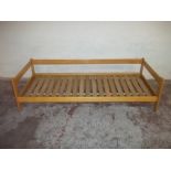 A SMALL SINGLE BEECH DAY BED FRAME