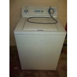 A WHIRLPOOL TOP LOADING INDUSTRIAL WASHING MACHINE