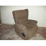 A BROWN FABRIC RISER RECLINER CHAIR