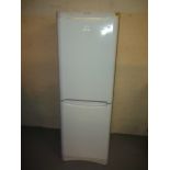 AN INDESIT FRIDGE/FREEZER