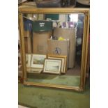 A FRAMED MIRROR APPROX. 110 X 90 CM