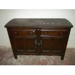 A DARK OAK ERCOL TYPE DRESSER, L 123 CM