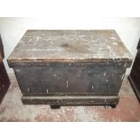 AN ANTIQUE WOODEN STORAGE CHEST