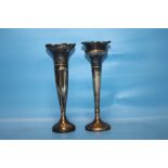 A PAIR OF HALLMARKED SILVER CANDLESTICKS WITH WOODEN BASES