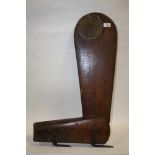 AN ANTIQUE WOODEN BOAT RUDDER