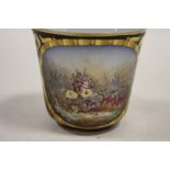 A FRENCH STYLE COBALT BLUE AND GILT HAND PAINTED TEACUP DECORATED WITH A BATTLE SCENE