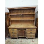 AN ANTIQUE PINE KITCHEN DRESSER ON BUN FEET H-180 CM W-147 CM