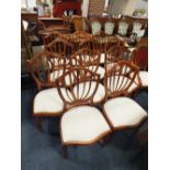 A SET OF TWELVE MODERN SHIELDBACK UPHOLSTERED DINING CHAIRS