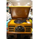 A MODERN COMBINATION RADIO/ RECORD / CD PLAYER