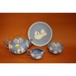 A WEDGWOOD JASPERWARE THREE PIECE TEA SERVICE, TOGETHER WITH A 'MAN ON THE MOON' CABINET PLATE (4)