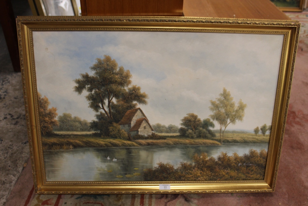 A GILT FRAMED OIL ON CANVAS DEPICTING A COUNTRY RIVER SCENE SIGNED P WILSON 84 CM X 58 CM