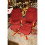 A PAIR OF RED UPHOLSTERED STRESSLESS STYLE ARMCHAIRS WITH STOOLS