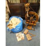A MODERN SPINNING WHEEL TOGETHER WITH WOOL, LEARN TO SPIN INSTRUCTIONS ETC