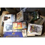 TWO BOXES OF BOOKS AND MAGAZINES, TOGETHER WITH A TRAY OF DVDS, GAMES AND TAPES ETC.
