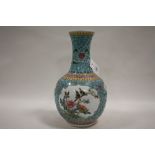 A LARGE CHINESE CERAMIC BOTTLE VASE DECORATED WITH BIRDS ON A BRANCH HEIGHT - 34CM