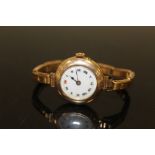 AN ANTIQUE UNMARKED YELLOW METAL WRIST WATCH, APPROX 23.3 g