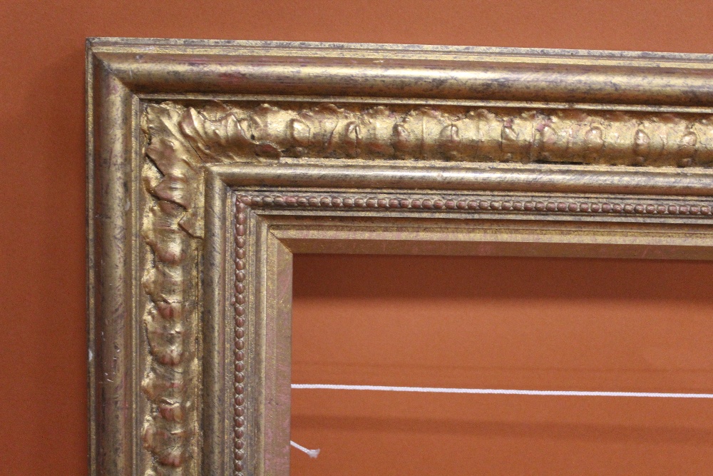 A 20TH CENTURY GILT PICTURE FRAME WITH GOLD SLIP -SLIP REBATE 31CM X 62CM FRAME REBATE - 34CM X 65CM - Image 2 of 3