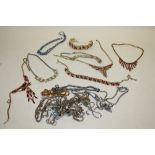 A COLLECTION OF VINTAGE COSTUME JEWELLERY, BRACELETS, NECKLACES ETC