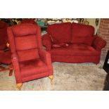 A SMALL UPHOLSTERED DROP ARM SOFA & SIMILAR ARMCHAIR