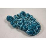 A CHINESE CERAMIC PENDANT / DROPPER IN THE FORM OF FIGURES FRUIT AND BUTTERFLY LENGTH 7.5CM