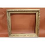 A 19TH CENTURY ACANTHUS LEAF DESIGN GILT PICTURE FRAME - REBATE 58CM X 68CM