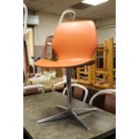 A MODERN RETRO STYLE ORANGE CHAIR