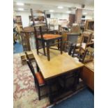 AN OAK DRAWLEAF DINING TABLE TOGETHER WITH 4 ERCOL CHAIRS