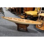 A HAND BUILT WOODEN POND YACHT ON STAND A/F LENGTH - 123CM