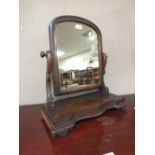 AN ANTIQUE MAHOGANY SWING MIRROR H-55 W-47 CM