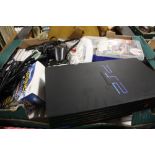A TRAY OF GAMES CONSOLES AND GAMES TO INCLUDE NINTENDO WII, PS2 ETC.