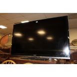 A LARGE SHARP 602 FLATSCREEN TV WITH REMOTE