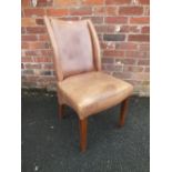 A MODERN TAN LEATHER DINING CHAIR