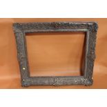 A 19TH CENTURY DECORATIVE GILT PICTURE FRAME (REBATE) 63CM X 52CM