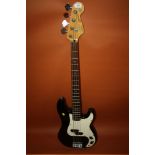 A SQUIRE PRECISION BASS GUITAR BY FENDER