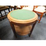 AN OAK ART DECO STYLE CIRCULAR 2 TIER TABLE H-56 CM DIA. 57 CM