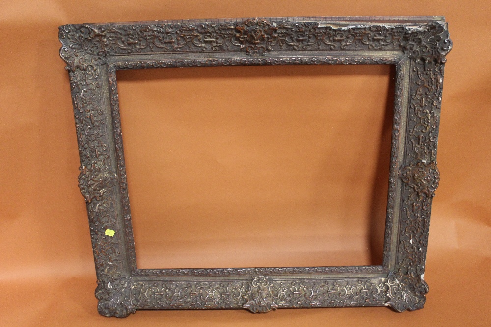 A 19TH CENTURY DECORATIVE GILT PICTURE FRAME (REBATE) 63CM X 52CM